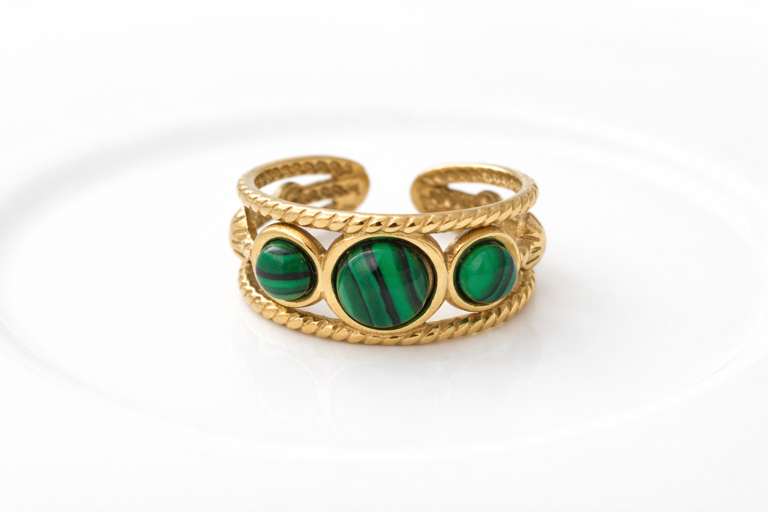 Gold ring with round malachite stones