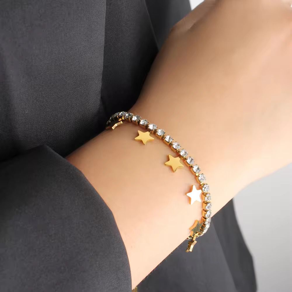 Sparkling zircon and gold star charm bracelet