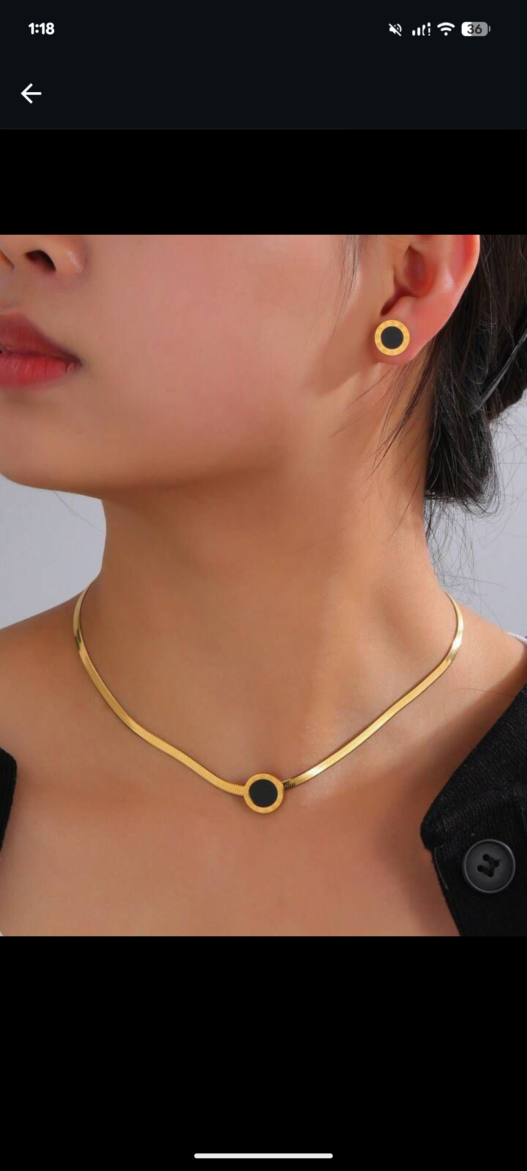 Elegant stainless steel necklace with black round pendant and matching earrings