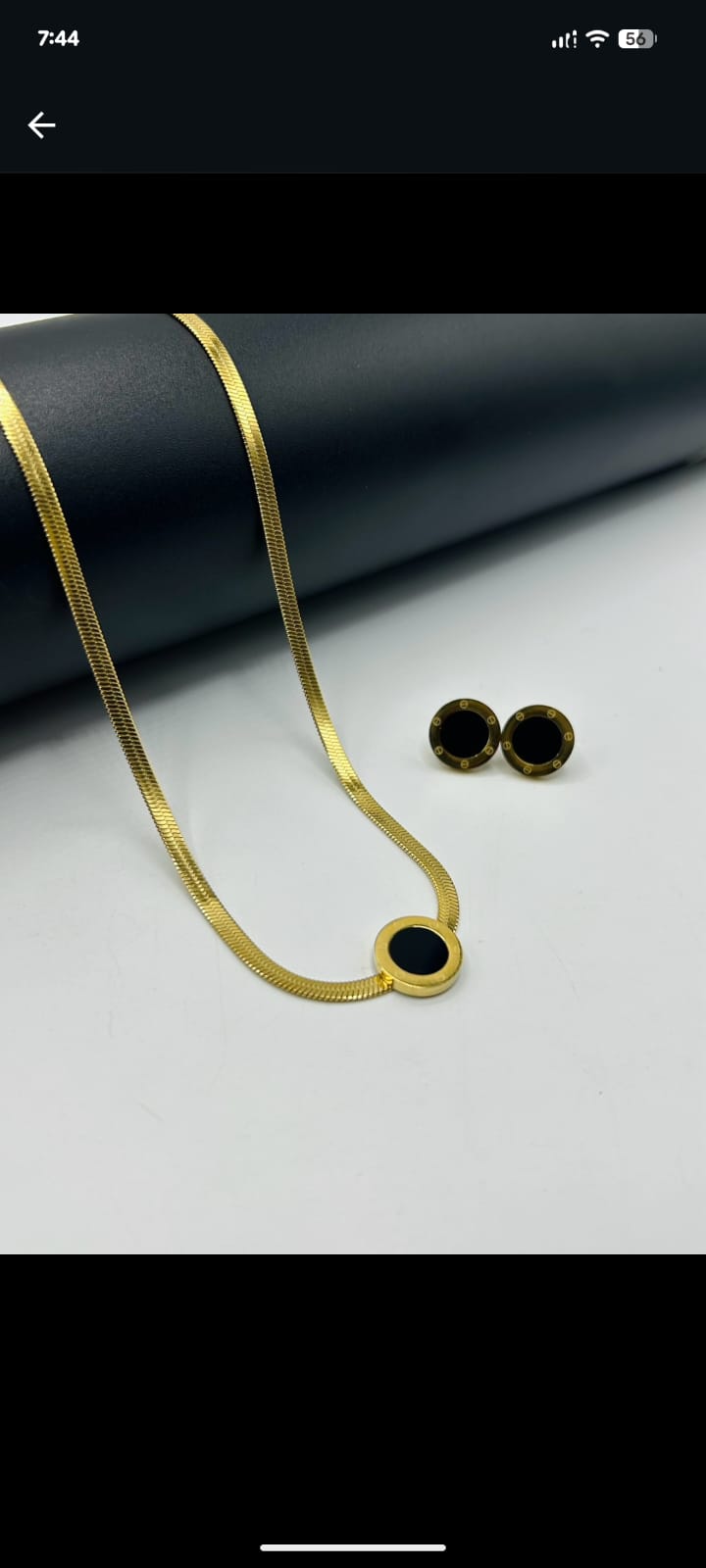 Elegant stainless steel necklace with black round pendant and matching earrings