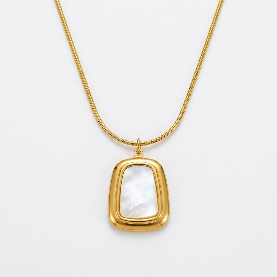 Elegant gold pendant with square amber stone
